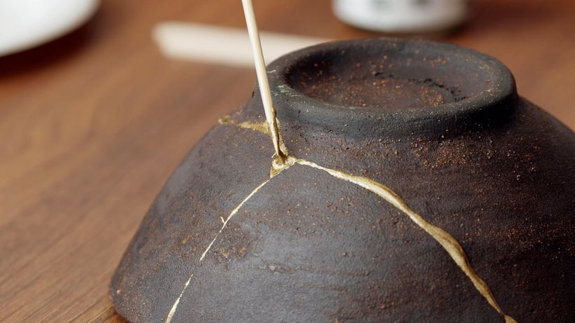 Kintsugi is the art of repairing broken pottery with gold
