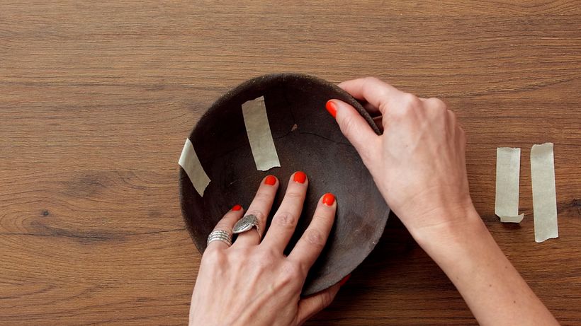 Use the masking tape to temporarily stick the pieces together