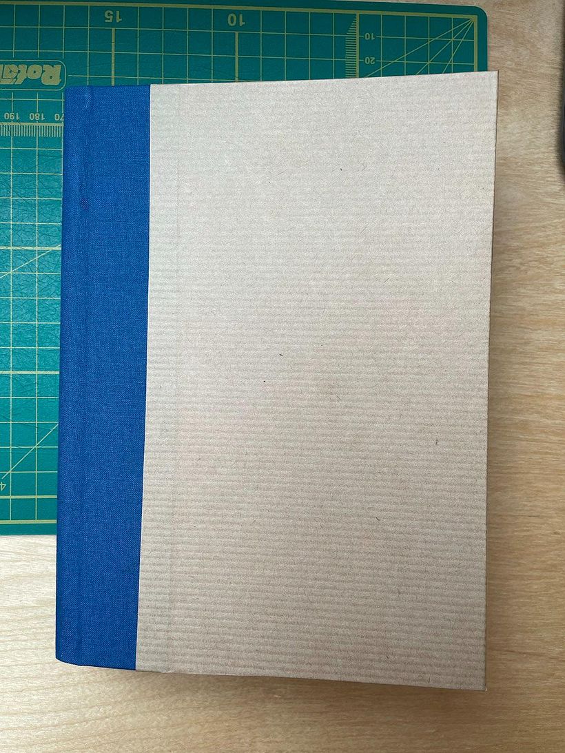 The front of the book, with bought book-cloth hinge and recycled paper covering.