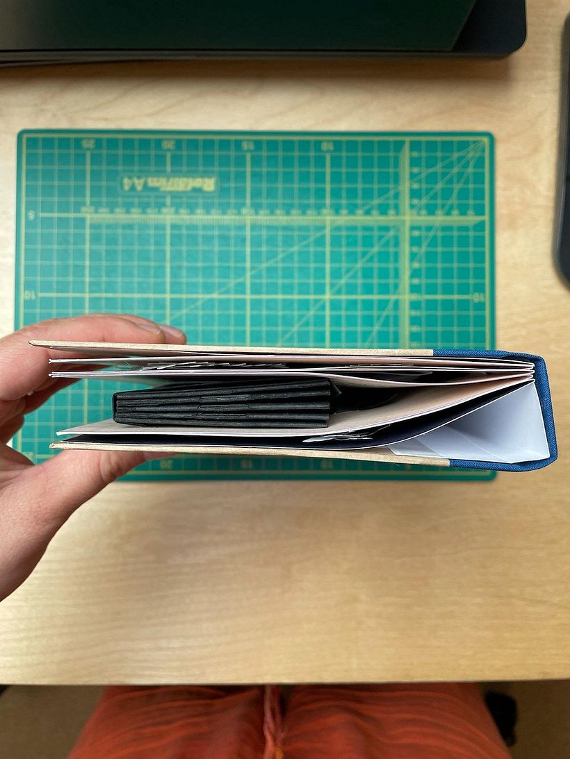 The book, closed and showing how much the shadow box distorts it.