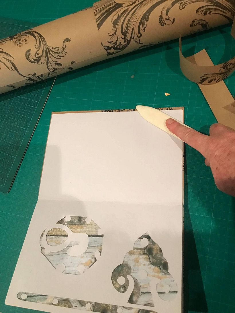 using folder to strengthen gluing of end papers