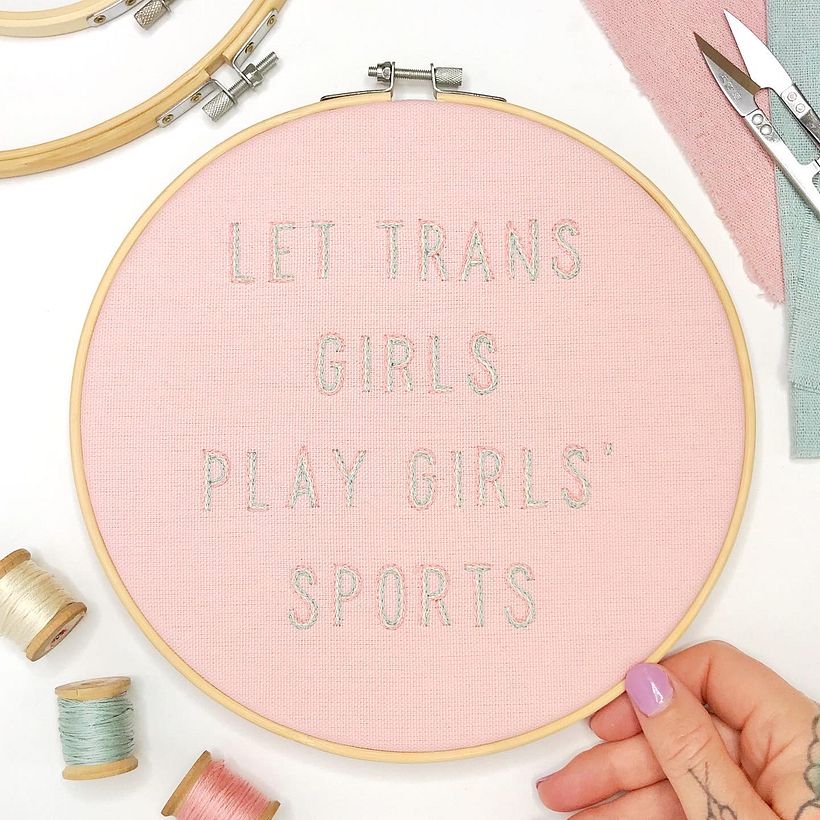 "Let Trans Girls Play Girls' Sports," hand stitched in 9" hoop.