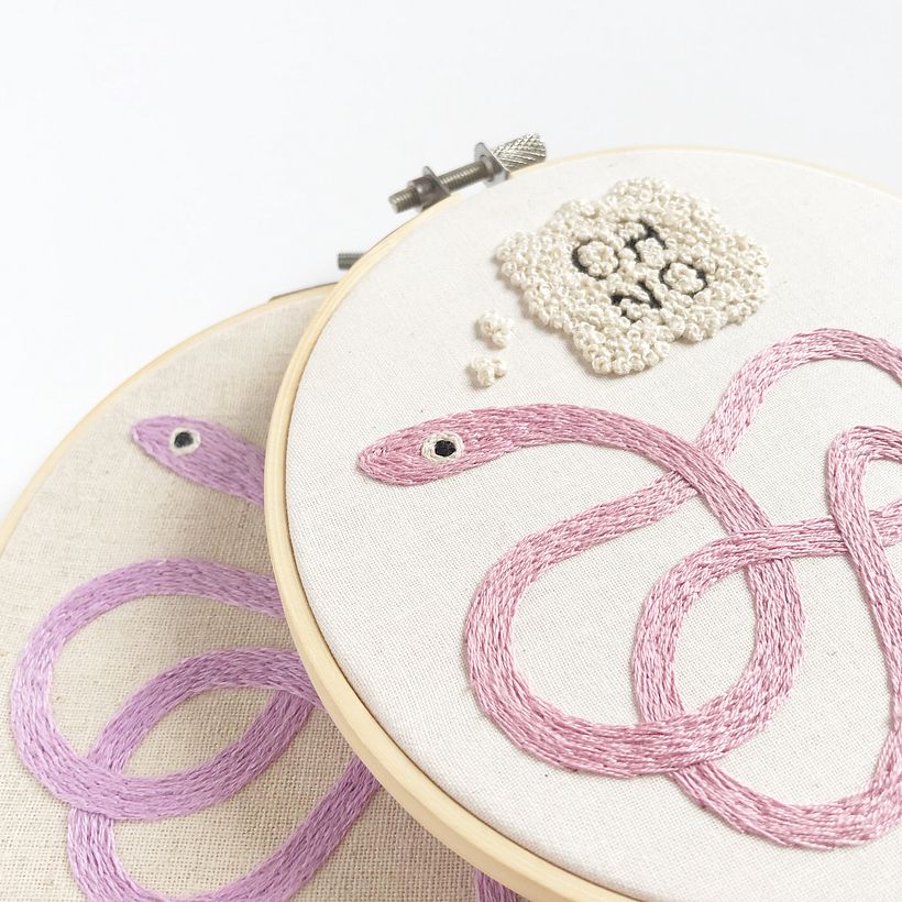 "Snek Stuk" hoop. 6" dia. cotton thread on linen.