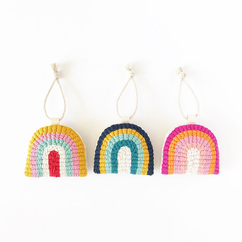 Hand tufted rainbow ornaments.