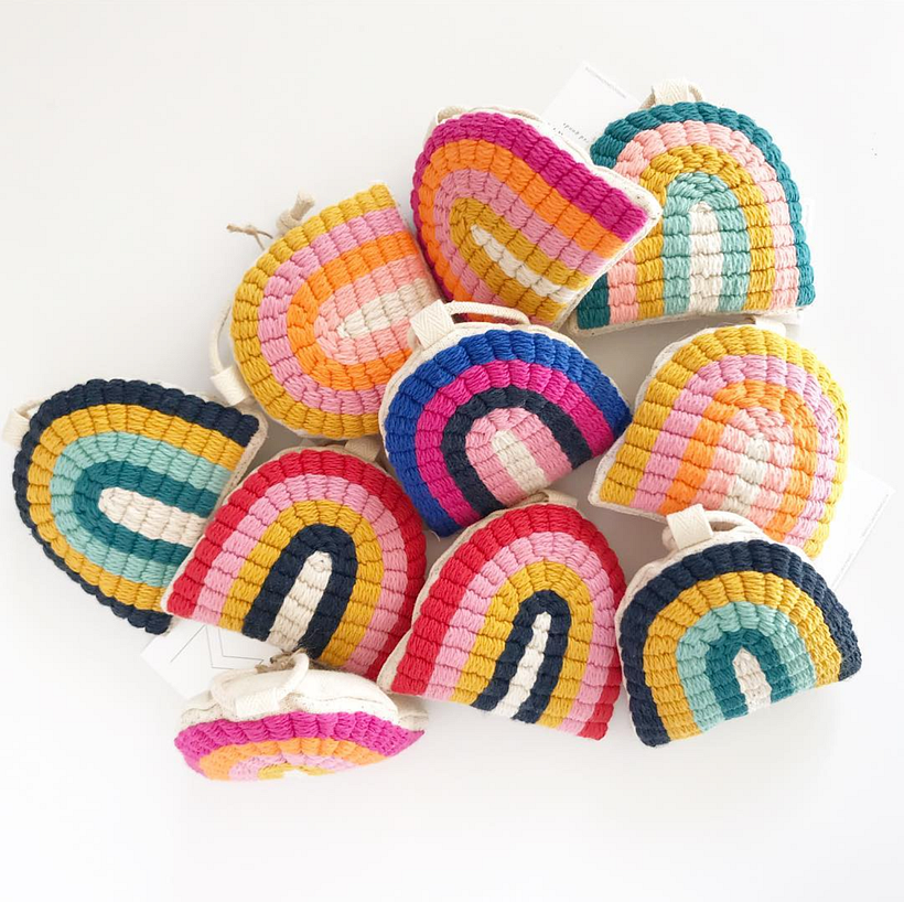 Hand tufted rainbow ornaments.