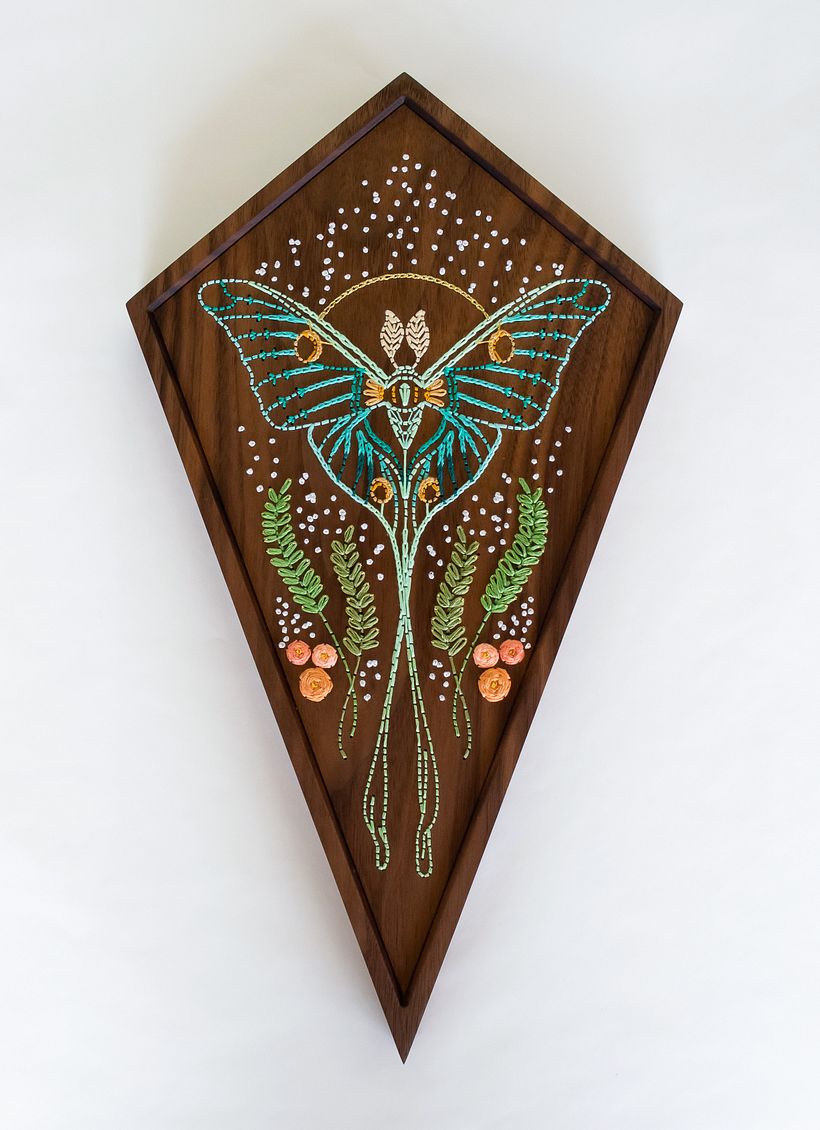 Walnut hardwood, metallic thread, cotton thread.