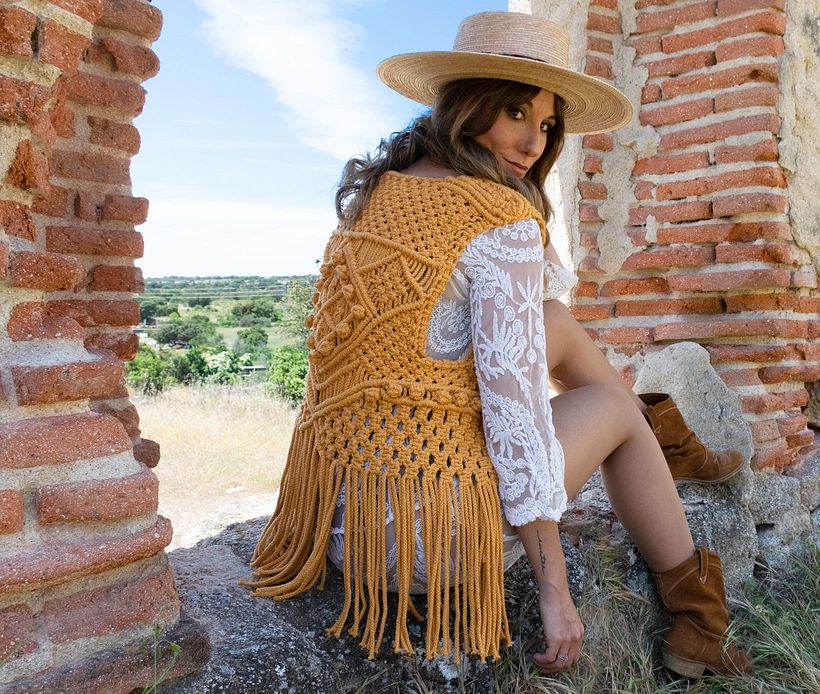 The textile artist wearing one of her designs.