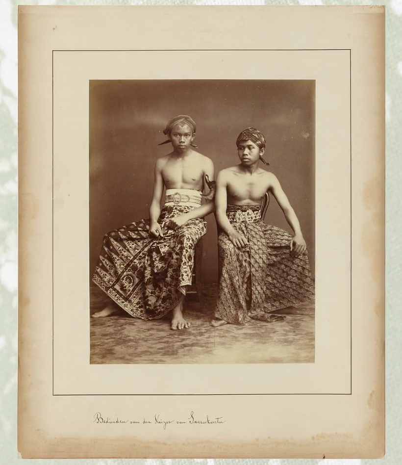 Southeast Asian men wearing sarongs.