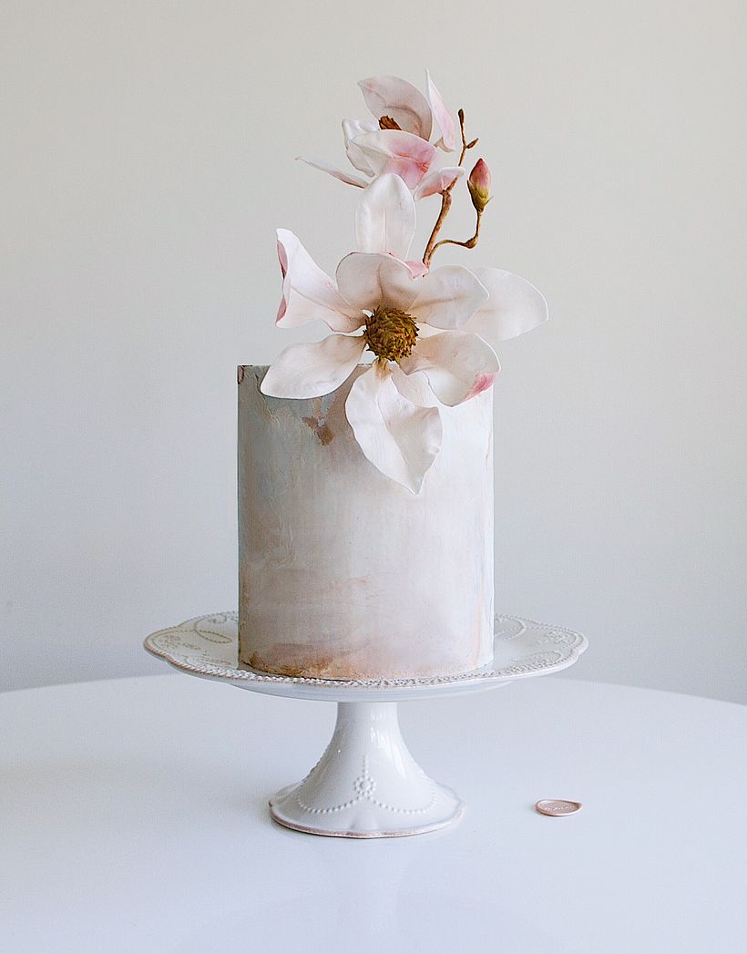 Minimalist fondant marble with handcrafted sugar magnolias