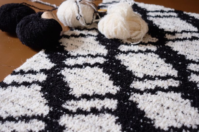Kuutio pattern made with fluffy boucle yarn.