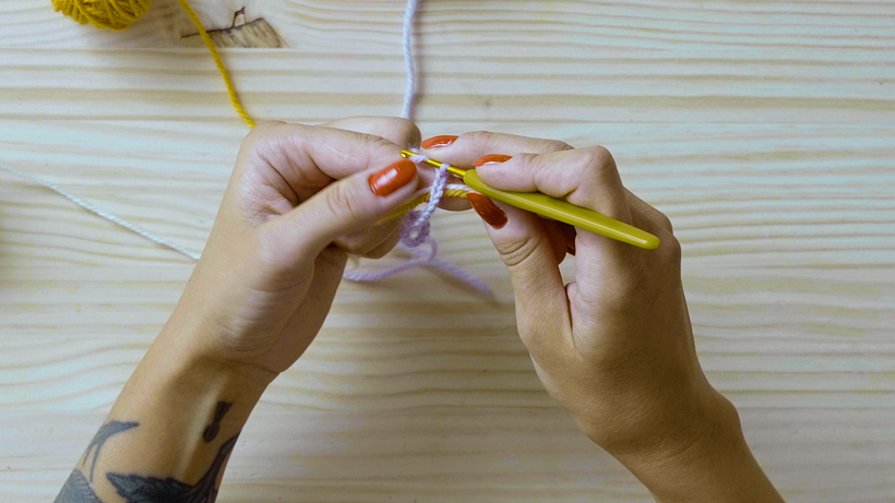 Bring the lilac yarn over your hook