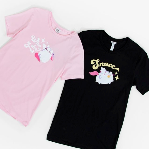 Pusheen an be found on all sorts of merchandise, like these T-shirts. Photograph: @pusheen via Instagram.