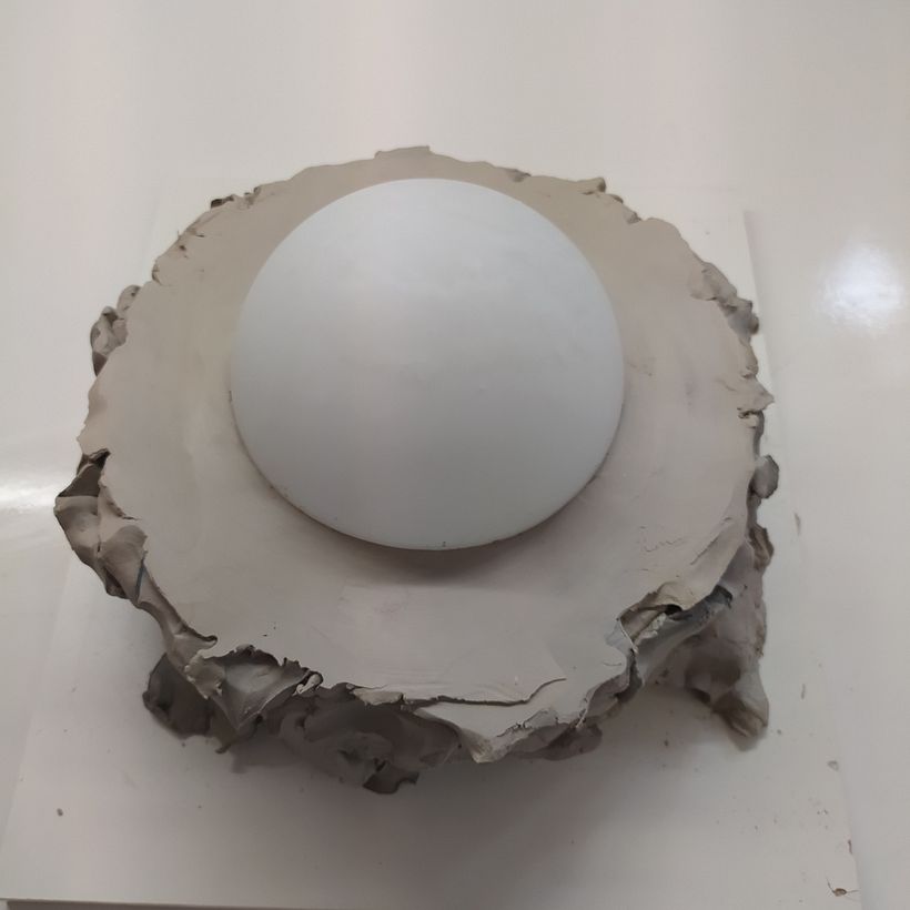 burrying the object to create 1st half of the mold