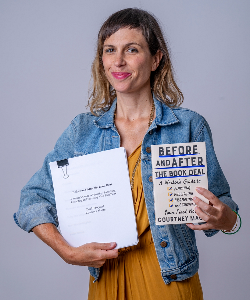 Courtney standing with her book proposal...and the book that it became!