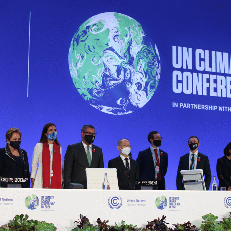 Joe Biden, Greta Thunberg, and the COP26 team. Photo credits: UNFCCC COP26 via Flickr / courtesy Johnson Banks.