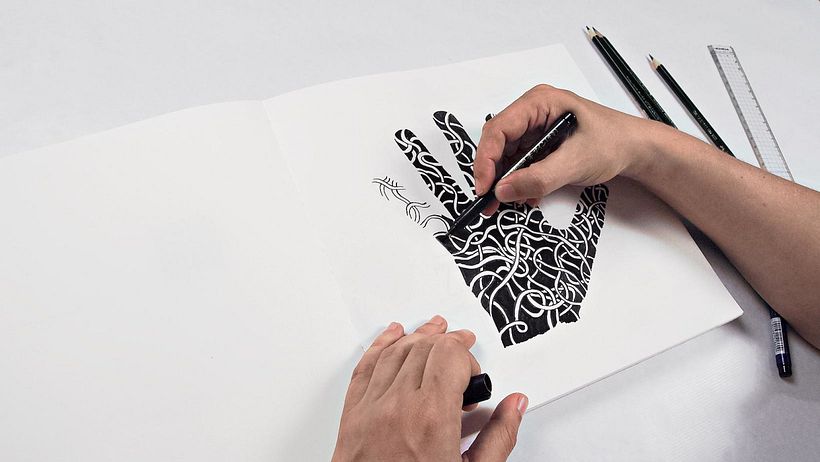 Lizzie creating a Zentangle design