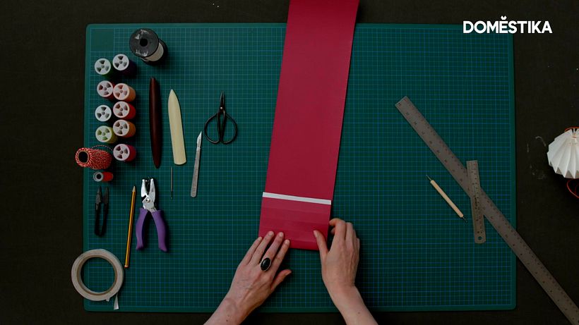 Fold along each scored line, turn the paper over, and fold the other way