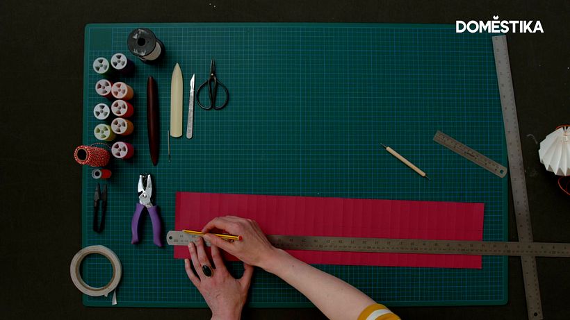 Draw a pencil line 6cm and 8cm down on your sheet of paper