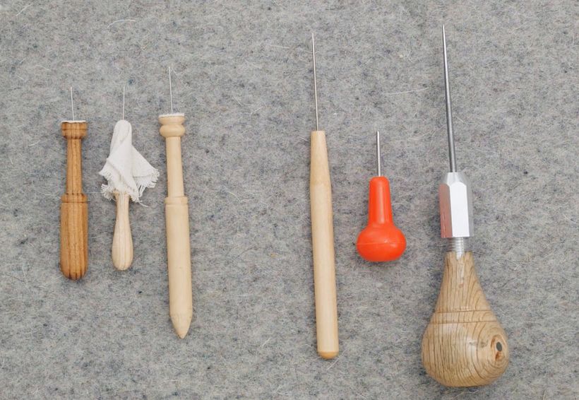 Different punch needles for embroidery on paper.