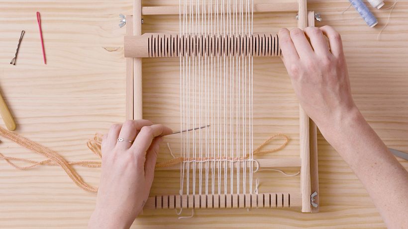 Begin weaving, starting two or three warp threads in.