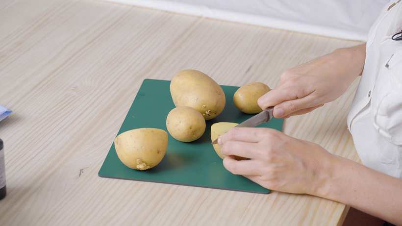 Cut your potato in half, and then in quarters