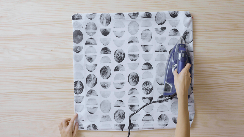 Allow the ink to dry, turn over the cushion, and iron