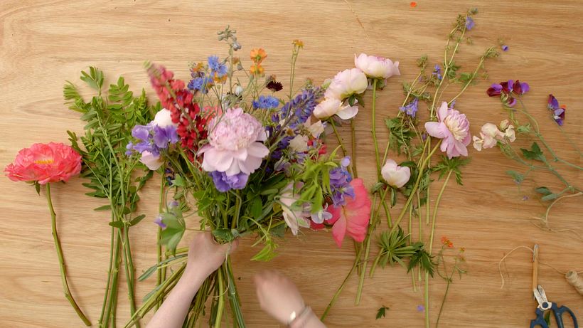 Lay your bunch on a surface and tie with twine