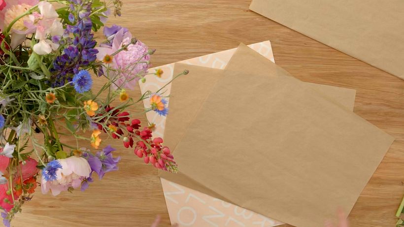 Fold your tissue paper in half at an angle