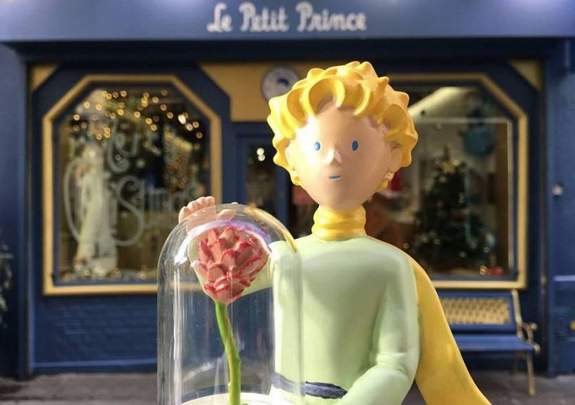 A figurine of the Little Prince with his rose at Le Petit Prince Store in Paris [Source: Sortiraparis.com].