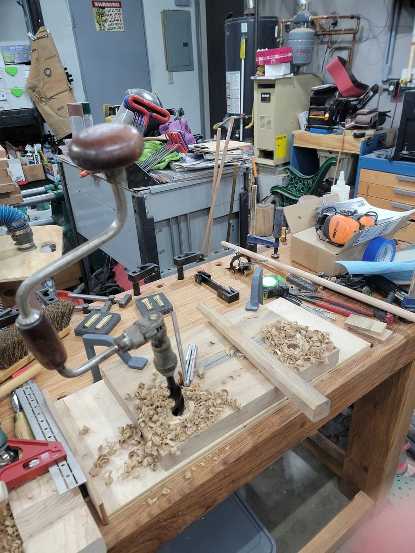 Boring the holes in the bottom of the seat for the legs at 13°