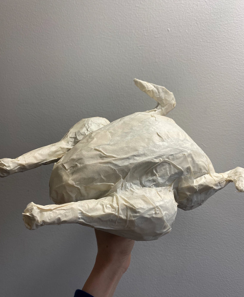 We covered the aluminum foil with masking tape to create an ideal base for the silicone. 