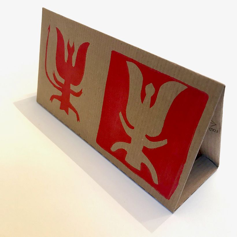 The folded card, printed on kraft paper.