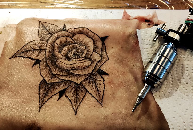 Rose on pigskin. Second week trying with tattoo machine.
