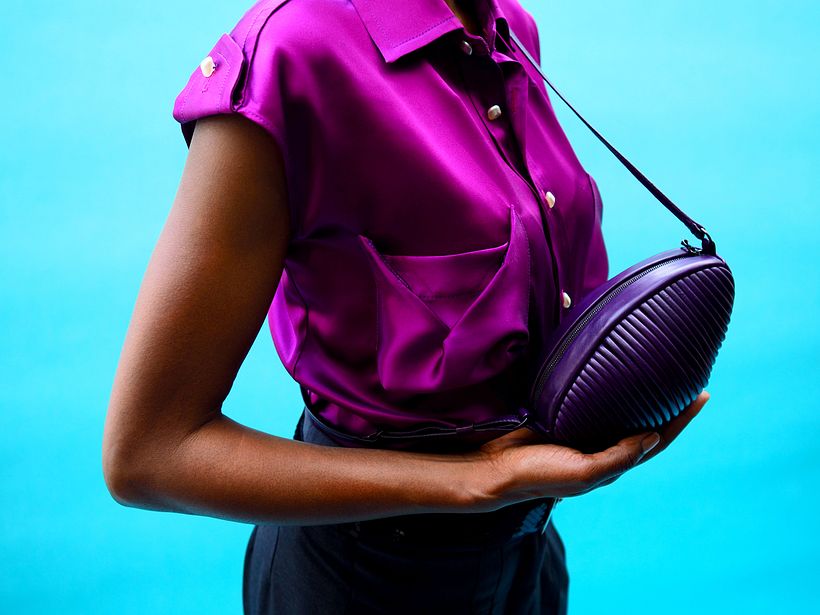 Core bag worn with origami pocket shirt and pleat front peg trousers
