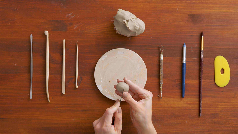 Roll your piece of clay into an even ball.