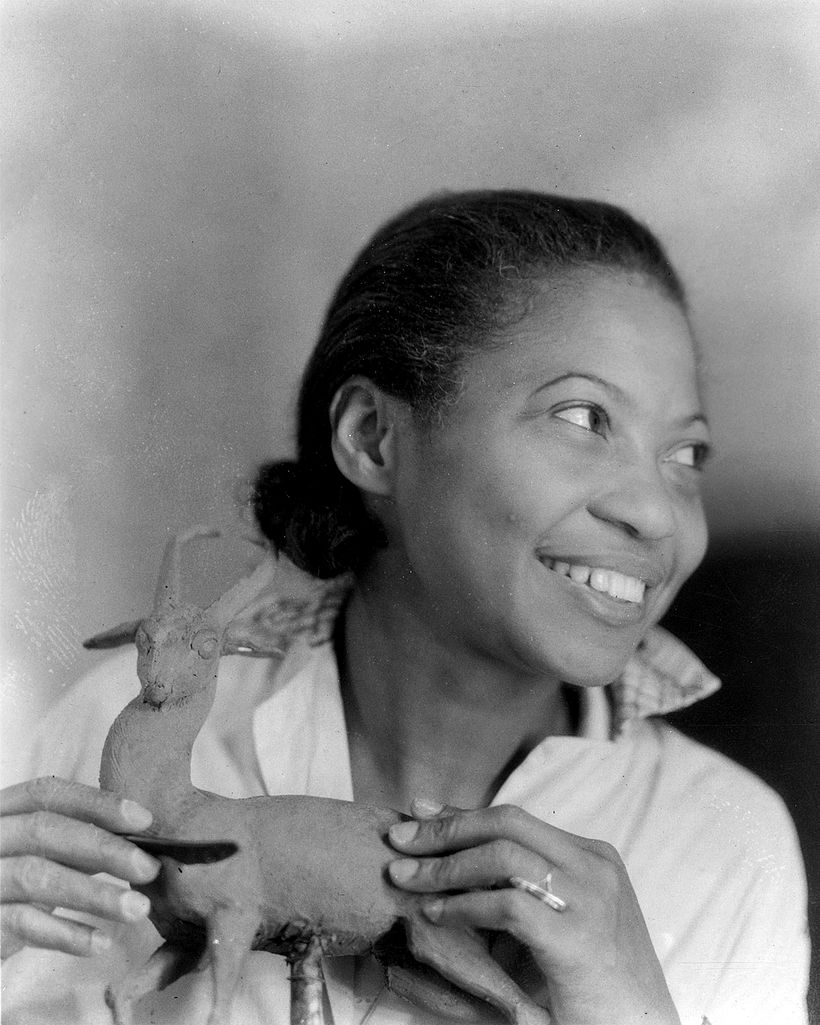 Augusta Savage preparing one of her many sculptures of animals, Harmon Foundation Collection.