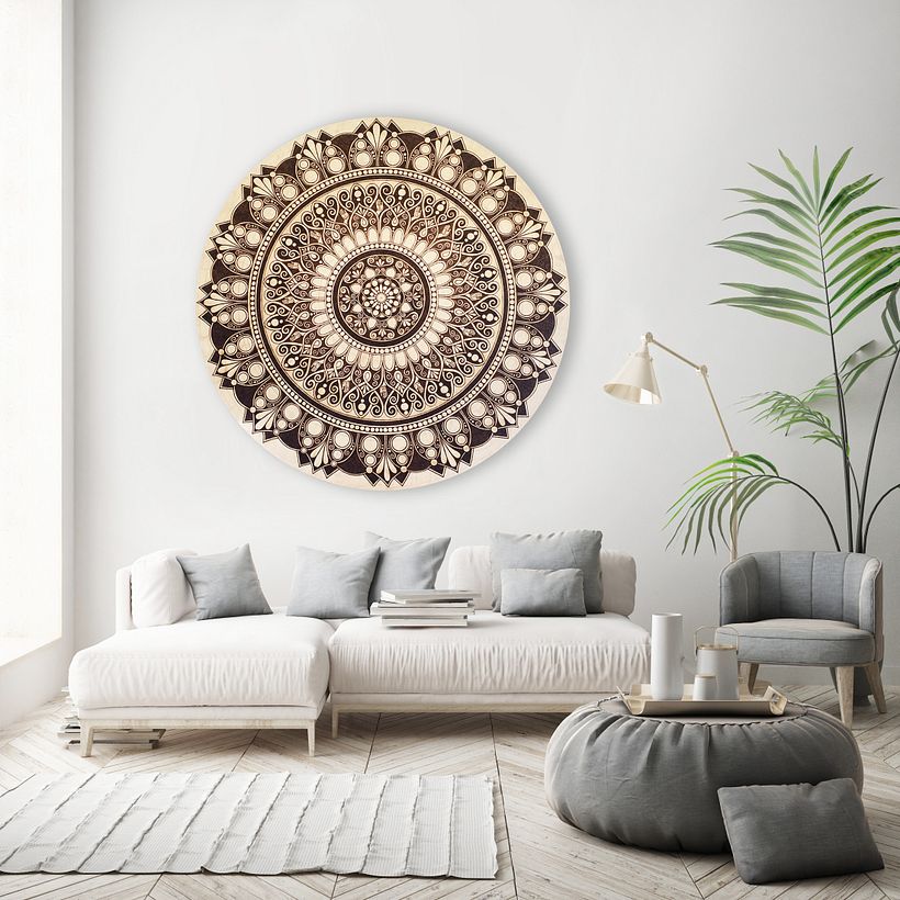 Lizzie's wood burn mandala hanging on a client's wall.