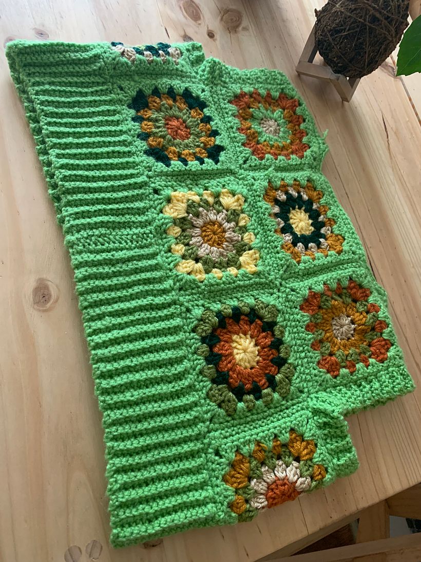 green sweater vest back