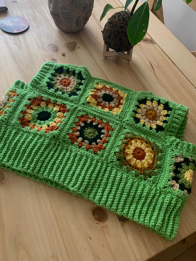 green sweater vest front