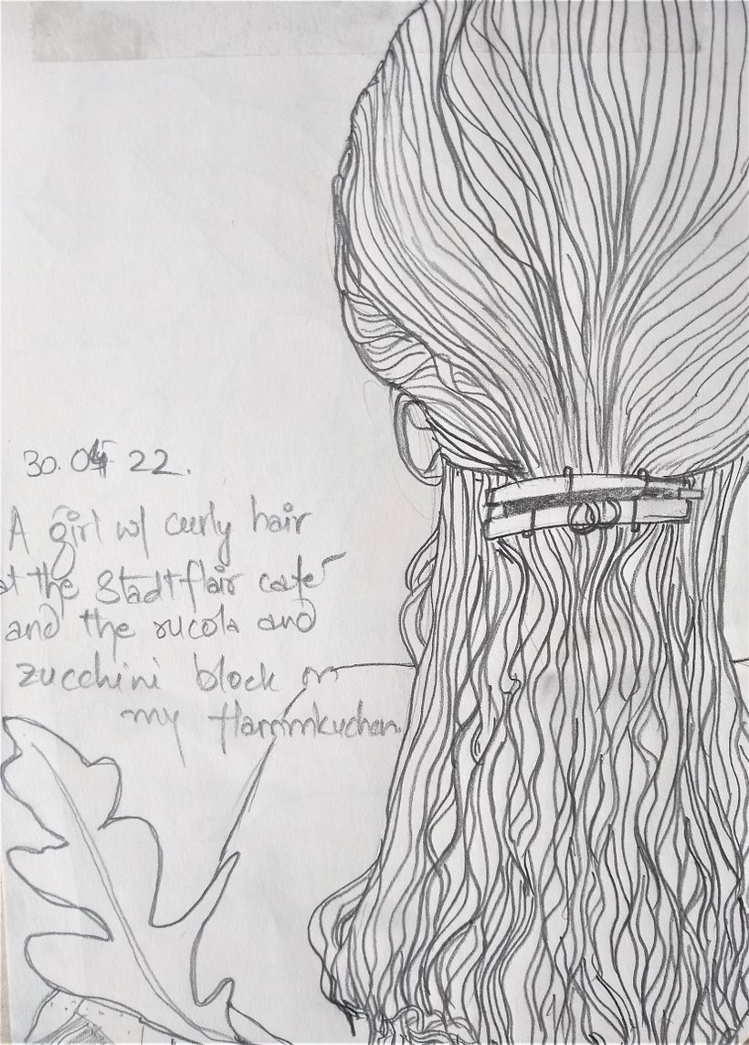 A young lady with curly hair at Stadtflair, a cafe in Koblenz