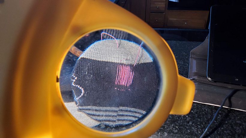 Weaving under helpful magnifying glass. 