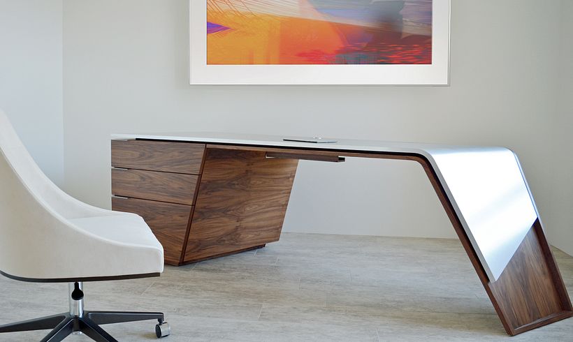 Custom executive desk made from walnut and brushed stainless steel.
