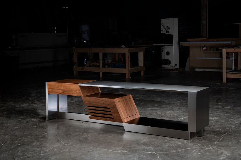 Stereo console featuring a record player drawer and speaker cabinet. Made from Rosewood and stainless steel.