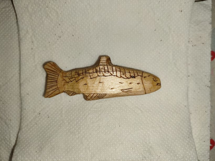 Salmon figurine in basewood