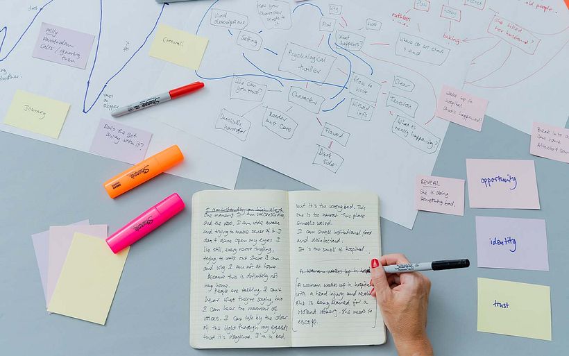 Emily builds out from early drafting to create her larger plot for a thriller in her course.