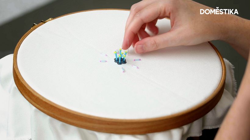 Play around with different beads and sequins to find unique patterns for your embellishment.