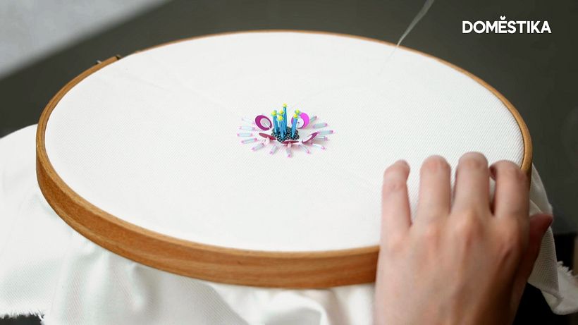 Continue building up your embellishment, considering size, color, and texture.