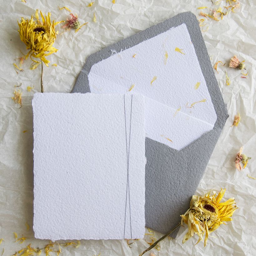Handmade recycled paper with calendula petals.