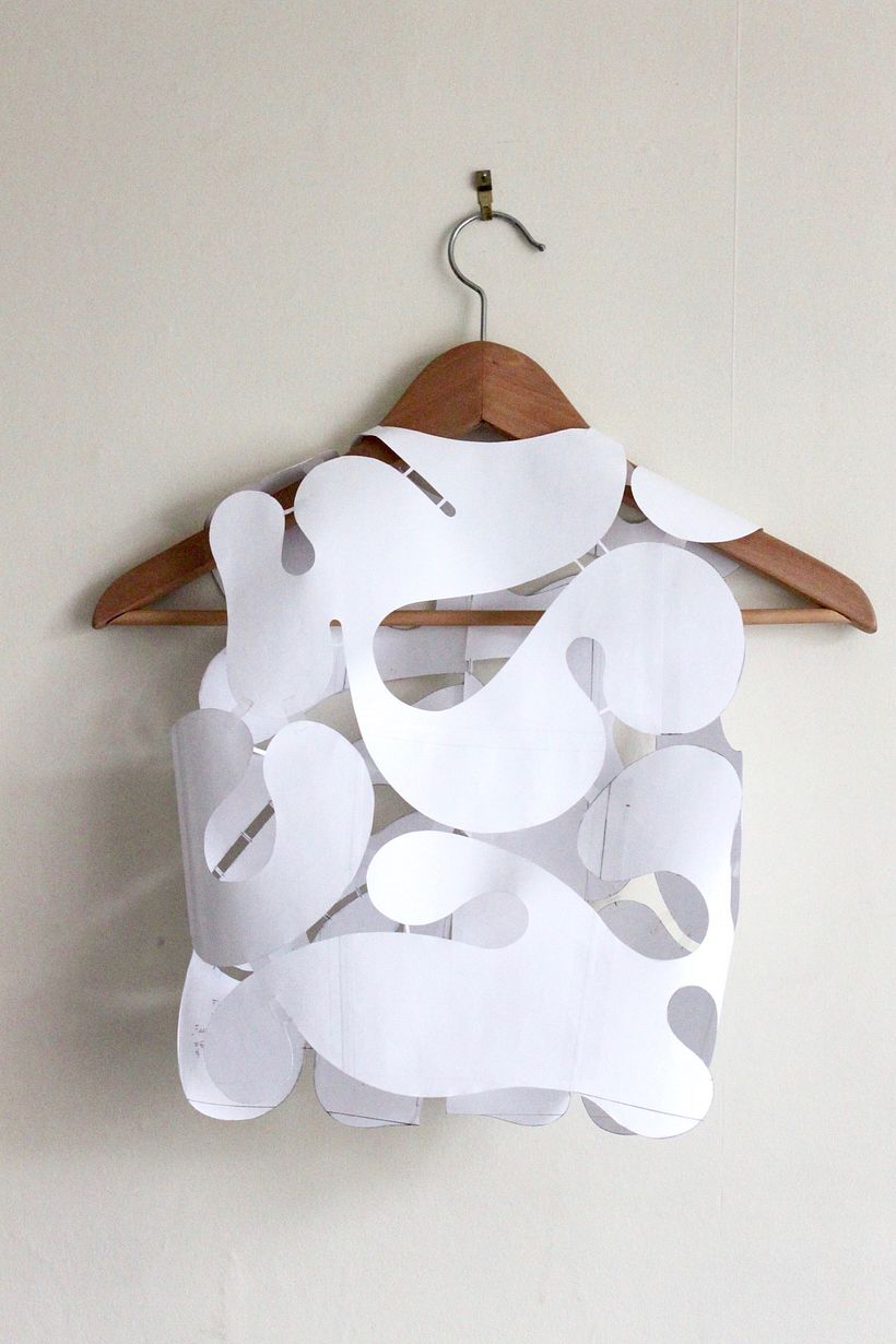 A paper mock-up is created : because 'links' are keeping the lace together, seams can be scrapped and the top moulded around.