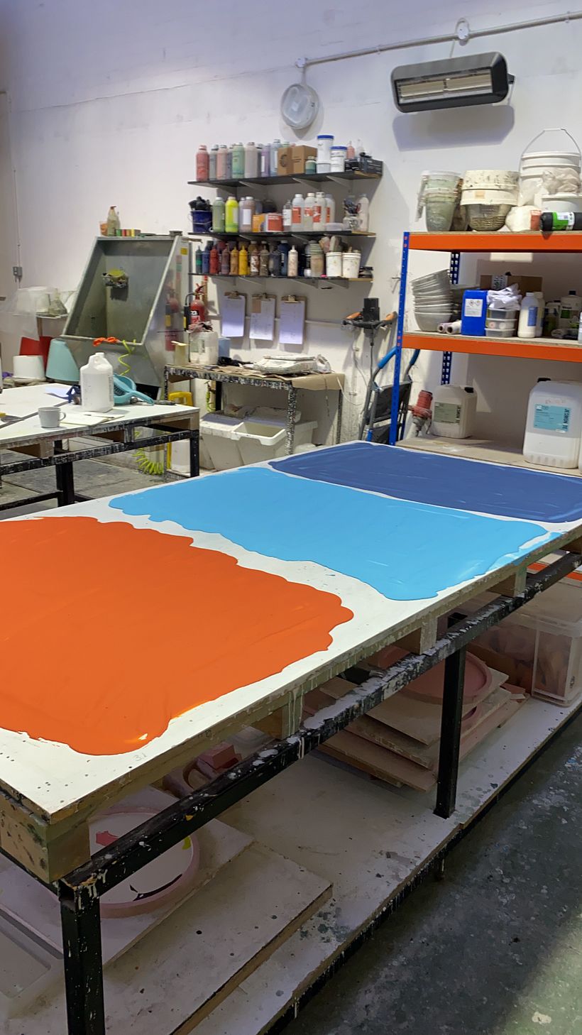 Pouring coloured jesmonite to be broken down into terrazzo chips